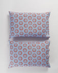set of 2 pillows in cornflower with red smiley faces