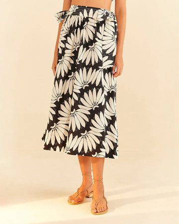 model wearing black and white floral abstract midi skirt with waist tie