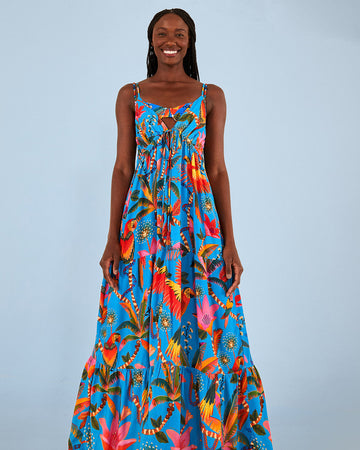 model wearing blue maxi cover up with deep V front and bold macaw print