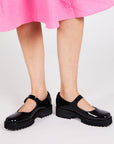 model wearing chunky black mary jane shoes