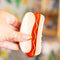 model holding hot dog hair clip with mustard squiggle