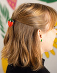 model wearing mini strawberry hair clip
