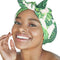 model wearing shower cap with tie front and all over palm print