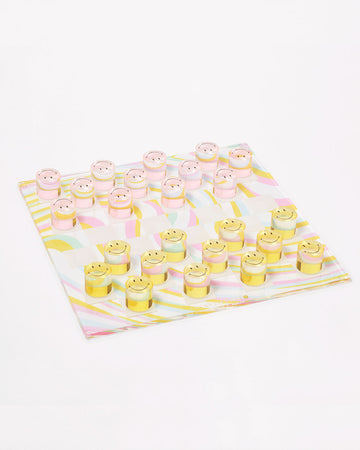 checker set with light pink and yellow smiley pieces and swirl board