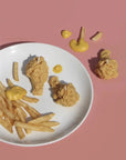 set of three crispy chicken candle set on a plate with fries