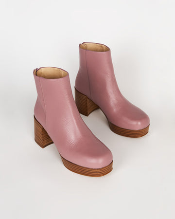 pair of mauve booties with wood stack heel and platform