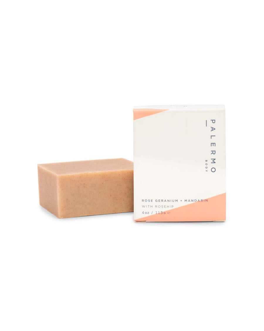 This Rose Geranium + Mandarin bar soap by Palmero comes in a natural beige color in minimalist packaging.