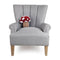 red and white mushroom shaped throw pillow on grey armchair