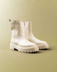 white combat style booties with thick sole and inside zipper