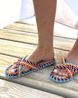 model wearing rainbow rope slip on sandals