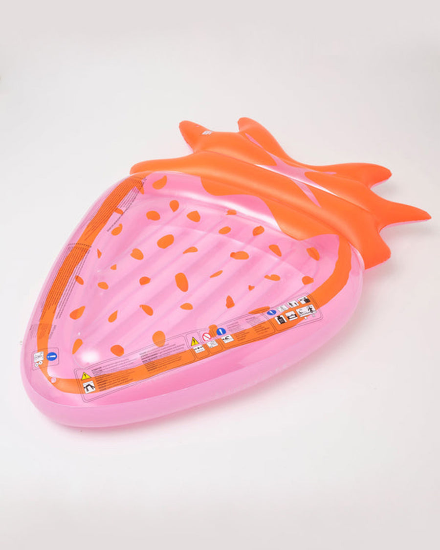 sideview of orange and pink large strawberry pool float