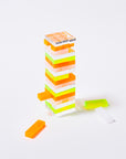 neon mini tumbling tower with pieces out of the tower