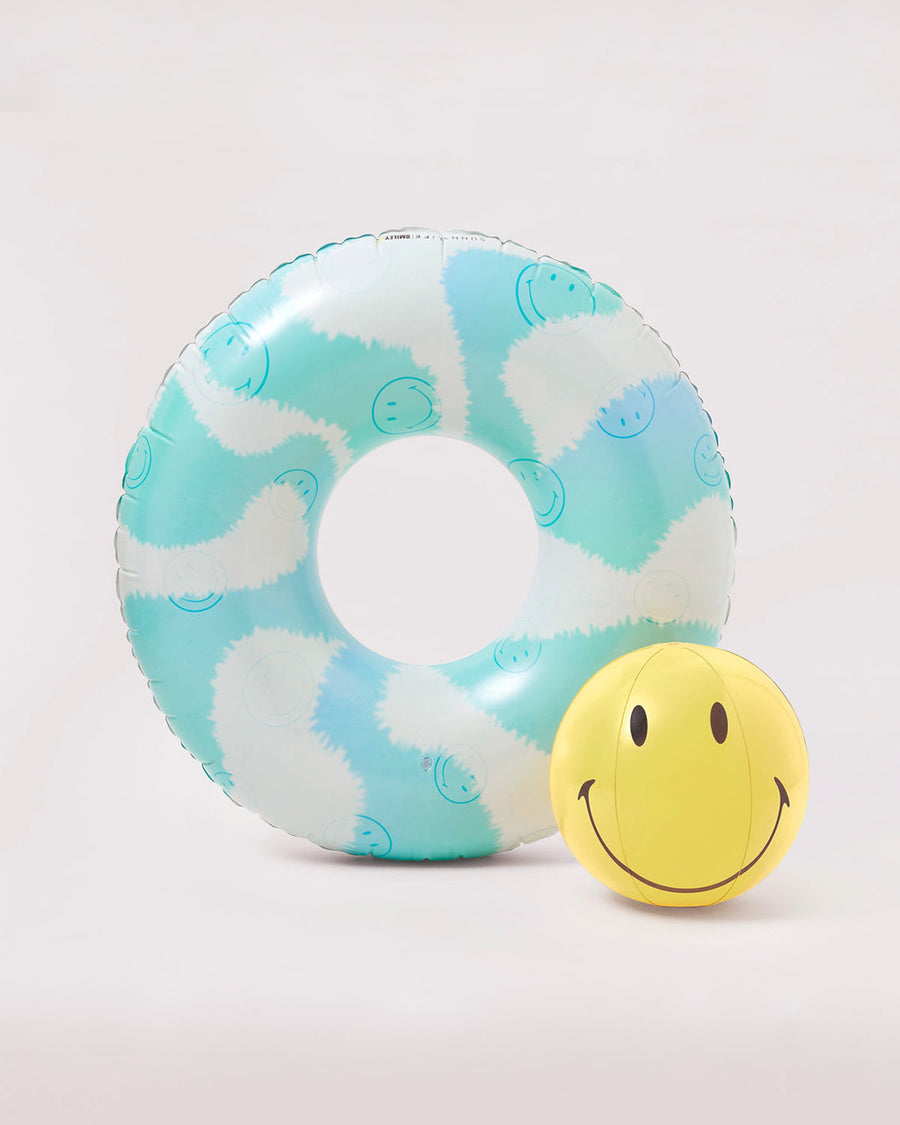 blue and white tye dye pool ring with smiley face graphic with matching yellow smiley face beach ball