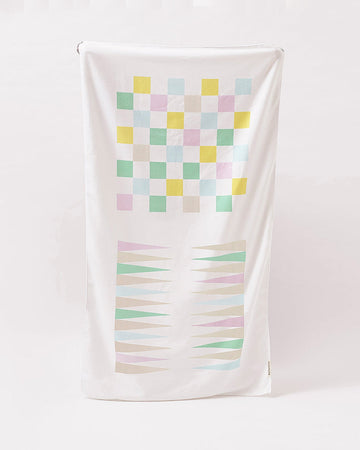 sunnylife towel with checker and backgammon design on it