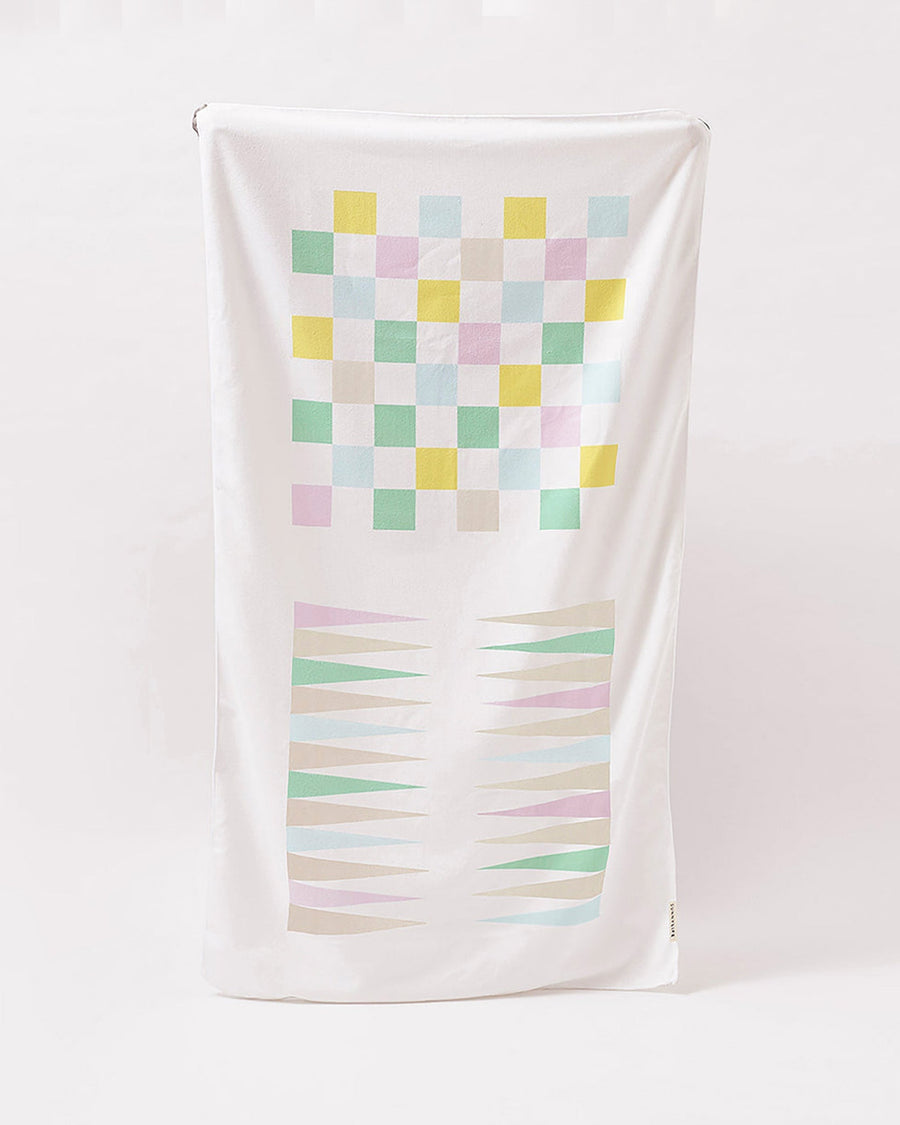 sunnylife towel with checker and backgammon design on it
