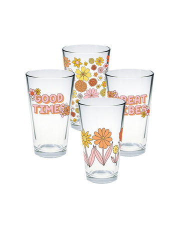 four pint glasses with groovy flowers on two, and the sayings 'good times' and 'great vibes' on the other two
