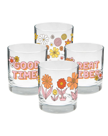 four rock glasses with groovy flowers on two, and the sayings 'good times' and 'great vibes' on the other two