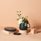 editorial image of smart heated tea kit with lid, spoon, mug, warmer and tea