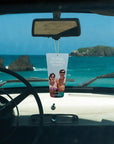 classic lotion scented air freshener from vacation sunscreen hanging in rearview mirror in car