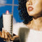 model holding lobby candle