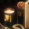 editorial image of vacation sunscreen candle with gold accent decor