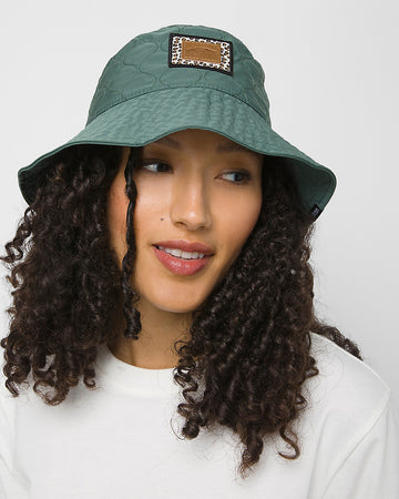 model wearing green quilted bucket hat with mixed animal print logo patch