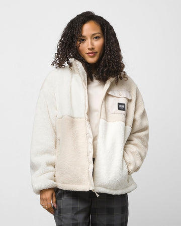 model wearing white/tan tonal color blocked sherpa zip up jacket