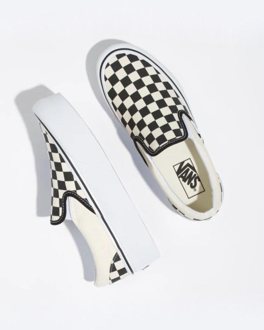 pair of vans slip ons with stacked sole and classic black and white checkerboard