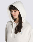 up close of relaxed oatmeal heather hoodie with dainty embroidered designs