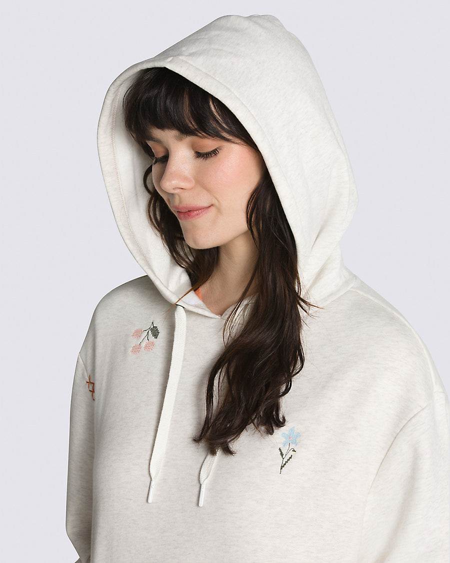 up close of relaxed oatmeal heather hoodie with dainty embroidered designs
