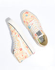 pair of vans sk8-hi shoe with light yellow ground and all over abstract and floral design