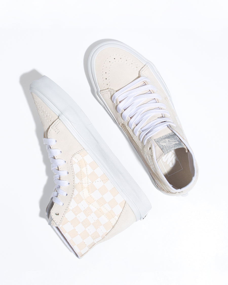pair of tan and white checkerboard vans sk8-hi tapered shoes