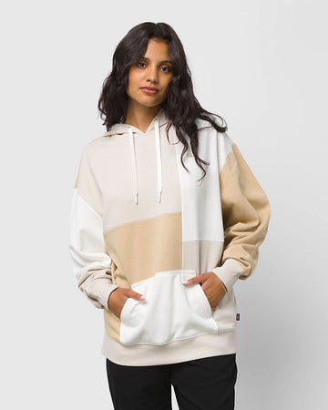 model wearing tan, brown and white colorblock hoodie with front kangaroo pouch
