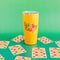 yellow lucky cup thermal mug with playing cards surrounding it