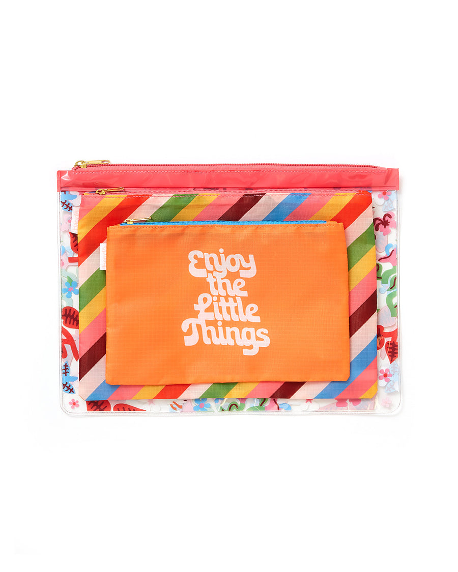 up close of beach carryall in 'enjoy the little things', rainbow stripe, and multi floral