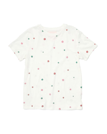 white cotton tee with a multi colored daisy pattern all over
