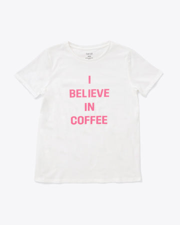 white tee with the words i believe in coffee in pink lettering