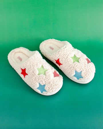 white fluffy slippers with colorful star pattern