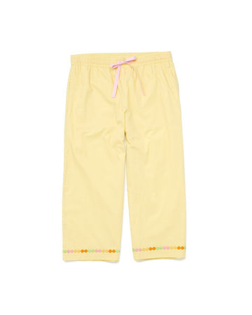 yellow cropped leisure pants with daisy chain accent at the bottom of the pant legs