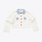white cropped jacket with blue collar, red buttons and blue and red embroidered flowers on front pockets