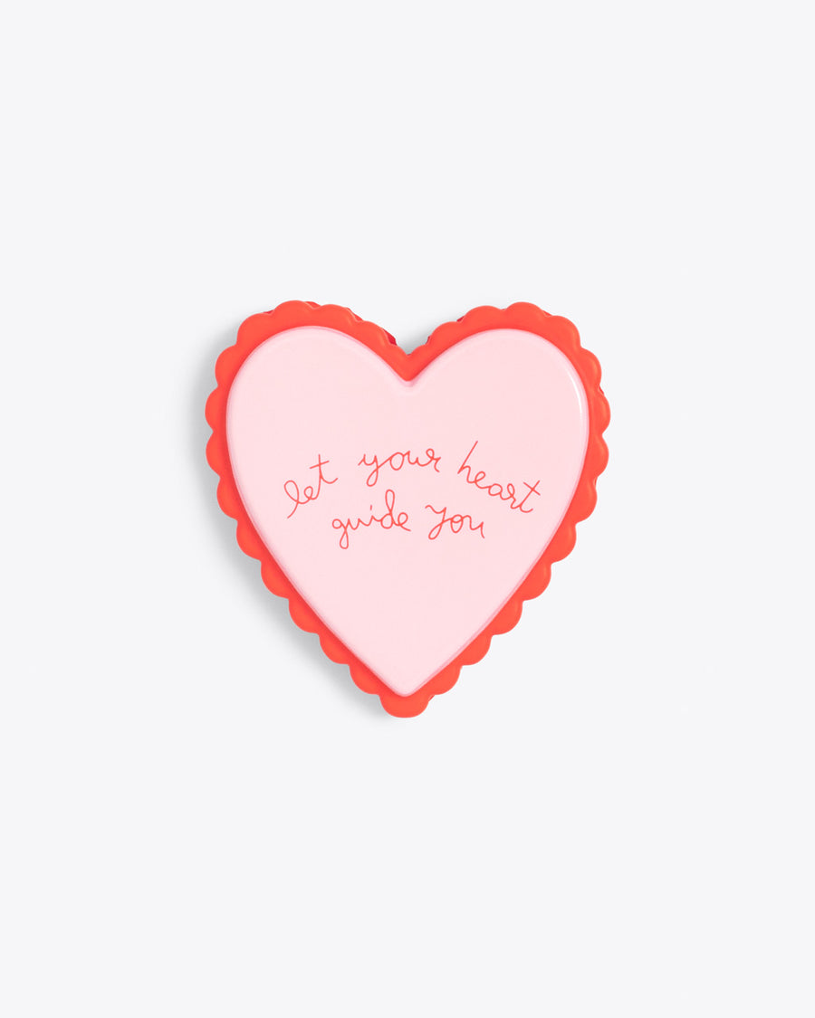 heart shaped de-stress ball with the words reading let your heart guide you