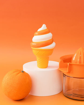 orange and white swirl creamsicle ice cream cone de-stress ball with orange and orange juicer