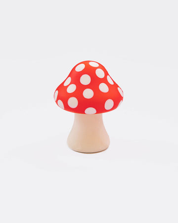 mushroom shaped de-stress ball with white stem and red top with white polka dots