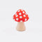 mushroom shaped de-stress ball with white stem and red top with white polka dots
