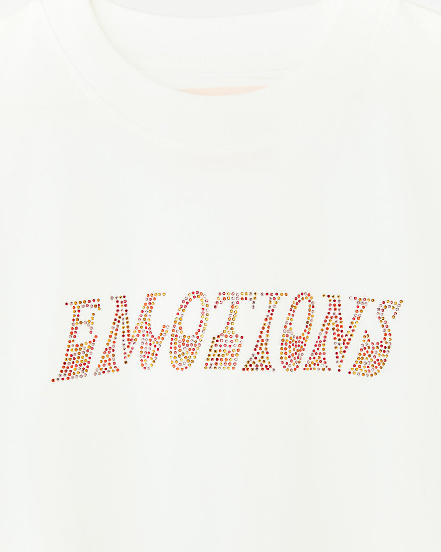 white tee with the word emotions in rhinestones