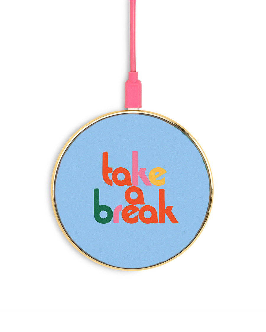 charging pad with blue ground and multicolor 'take a break' text on the front. also comes with pink charging cable