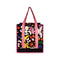 front view of reusable market bag with black ground, pink trim/straps, and all over multicolor abstract floral print
