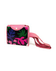 reusable market bag with black ground, pink trim/straps, and all over multicolor abstract floral print folded up