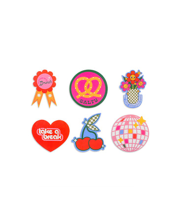 set of 6 jumbo stickers: 'i'd rather be at brunch' ribbon,'salty' with a pretzel, 'let your happiness grow' with smiling flowers in a vase, 'tale a break' with a red heart, checkered cherry, and pink/multi disco ball