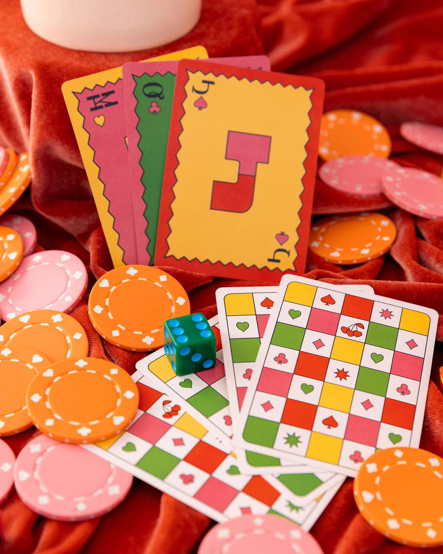editorial image of waterproof playing cards, poker chips, and dice